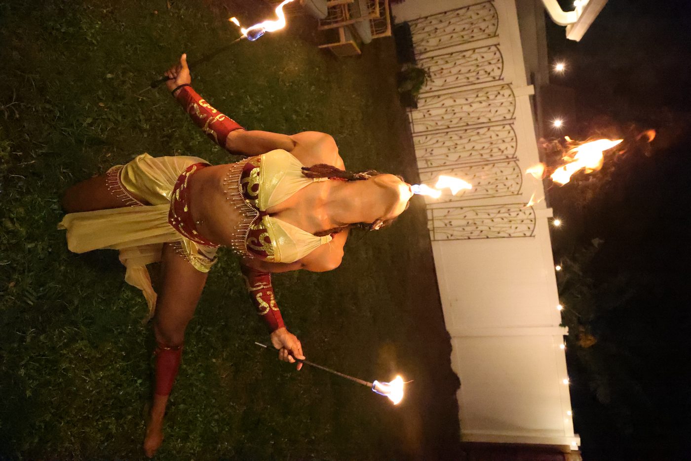 Triple fire goddess — three performers with fire fans